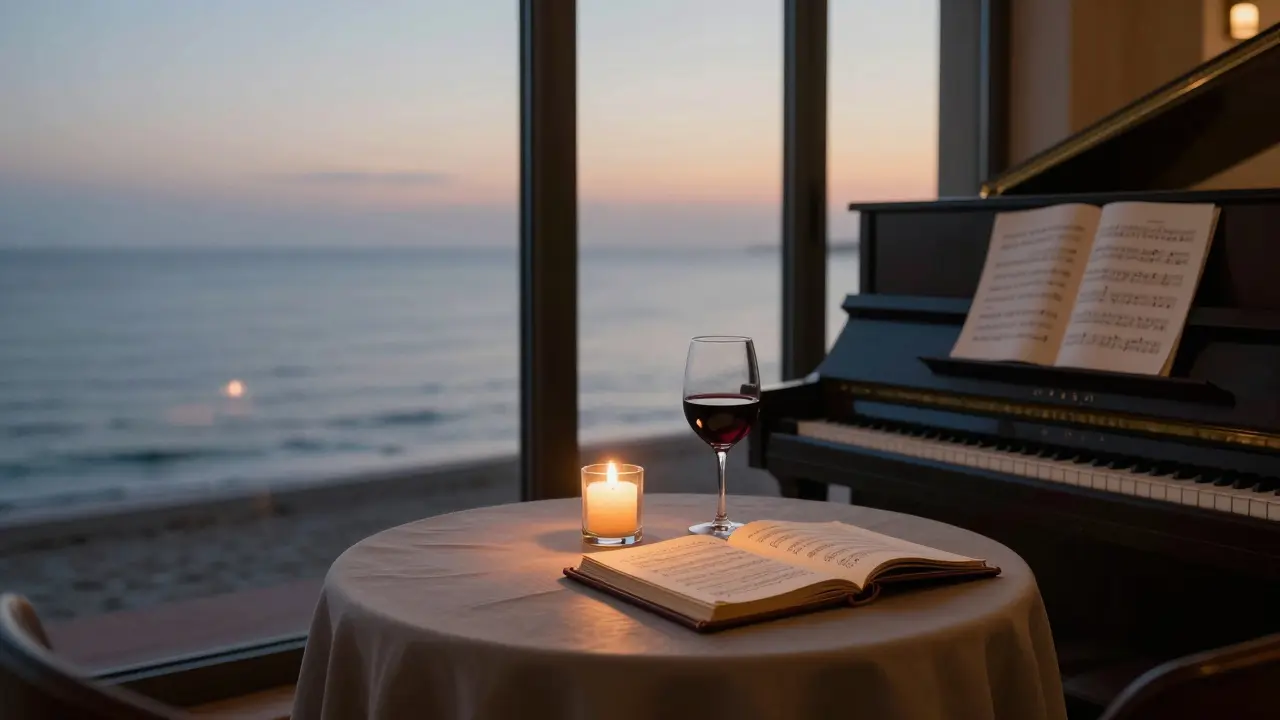 Candlelit lounge at dawn with wine glass and open wine list overlooking the calm Mediterranean Sea.